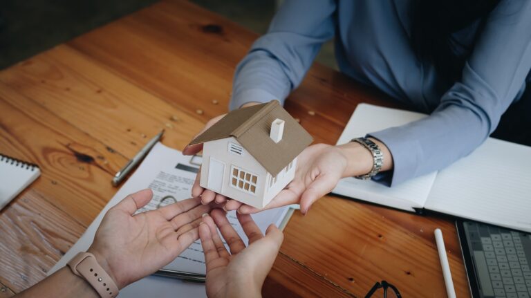 Real estate agent or sales manager offer home sale and explained the terms of signing the house